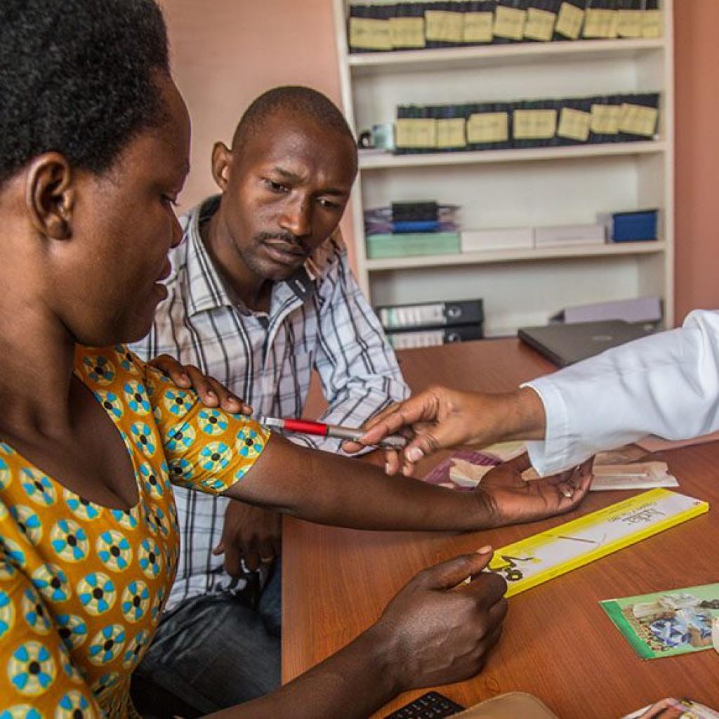 Photo credit: A nurse counsels clients in Rwanda on family planning, sexual and reproductive health and rights, and pregnancy prevention. (Yagazie/EmeziGetty Images/Images of Empowerment)